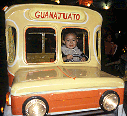 boy driving carnival bus
